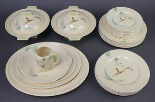 A Royal Doulton Coppice pattern dinner service comprising 12 small plates, 6 medium plates, 6 dinner plates, 3 oval meat dishes, a platter, 2 tureens and covers and a milk jug 
