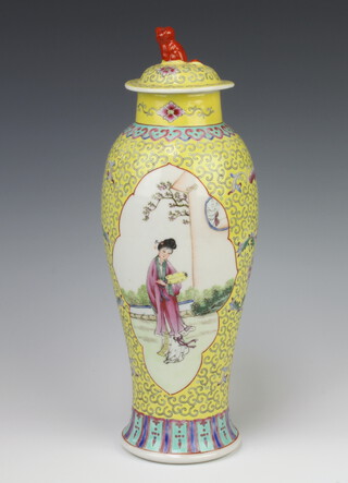 A Chinese Republic oviform vase and cover, the yellow floral ground with a figure of a lady with child in a garden setting and a lady holding a fan, having a shi shi finial and circular red seal mark to the base 30cm 