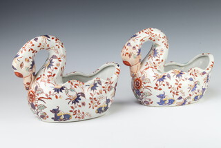 A pair of mid 20th Century models of swans decorated in the Imari pattern 21cm 