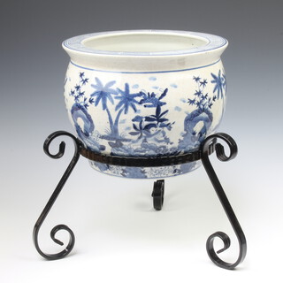 A 20th Century Chinese jardiniere decorated with flowers and trees 22cm on a wrought iron stand 