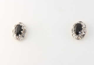 A pair of 9ct yellow gold oval sapphire and diamond ear studs 1.6 grams 