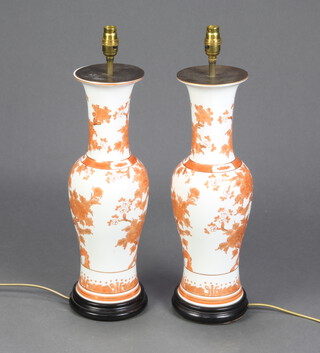 A pair of modern Chinese ochre oviform vases with flared necks, decorated with trees 44cm, converted to electricity 