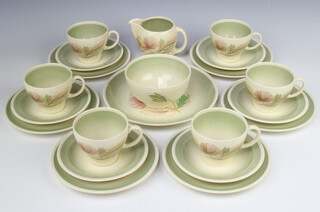 A Susie Cooper part tea set comprising 6 tea cups, 6 saucers, cream jug, sugar bowl, 6 small plates and a sandwich plate