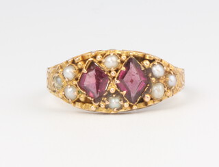 A 15ct yellow gold garnet and seed pearl ring size L 1/2, 2 grams 
