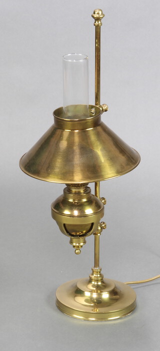 A table lamp in the form of a Victorian brass oil lamp with glass chimney 66cm h x 16cm 