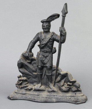 A Victorian cast iron door stop in the form of a highlander 38cm x 31cm x 7cm 