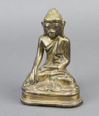 A Chinese gilt bronze figure of a seated Buddha 15cm x 9cm x 6cm 