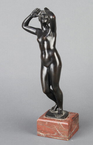 A 19th Century bronze figure of a classical standing naked lady, raised on a square marble base 28cm x 7cm x 6cm 