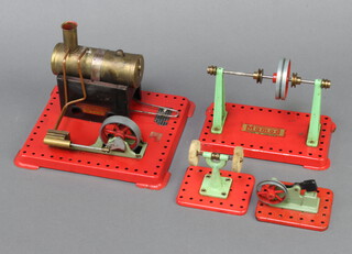 A Mamod stationary steam engine 13cm h x 19cm w together with ditto steam hammer, polisher and wheel 