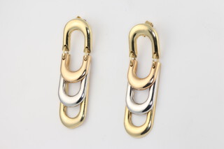 A pair of 2 colour 14ct gold earrings 5.5 grams and a pair of yellow metal earrings 2.2 grams 