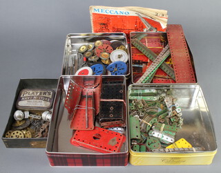 A collection of red and green Meccano together with a 3/2 Meccano brochure 
