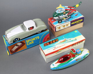 A Japanese DSK Life Like action tinplate helicopter Polizei boxed, a Friction sparking submarine MF964 boxed, a Chinese Friction Lucky tin plate sports car boxed 