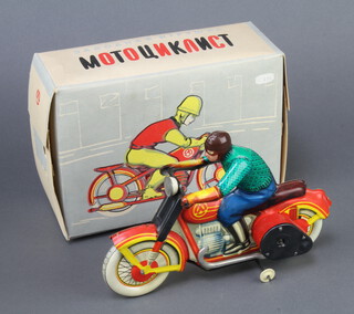 A Soviet Russian tinplate clockwork motorcyclist boxed (no key)