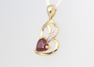 A 9ct yellow gold diamond and ruby pendant 0.9 grams