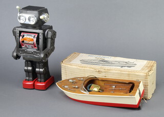A Japanese tinplate battery operated robot together with a ditto KS motorboat boxed 