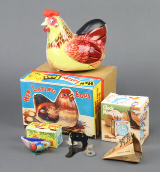 A Chinese M610 tinplate battery operated hen laying eggs boxed, a Chad Valley clock money box boxed, a Chinese M029 tinplate clockwork Bluebird boxed, a British made Silly Billy The Goat part boxed (f)  