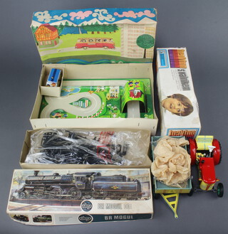 A French De La Mare La Munte tinplate clockwork train set boxed (box creased and bent), a Czechoslovakian tinplate tractor  boxed (box dented), an Airfix kit series 4 Bromo Guloo model boxed (box dented)  