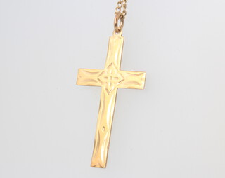 A 9ct yellow gold cross pendant and chain 3.5 grams, the chain is 56cm 