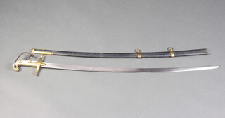 A Mameluke style sword with ivory and gilt metal grip, having a 85cm blade complete with scabbard 