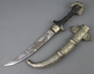 A Jambuka with 22cm blade contained in a white metal and brass scabbard 