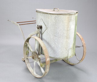 A 19th Century aluminium and iron water carrier with iron spoke wheels 86cm h x 146cm l x 72cm w 