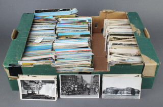 A large quantity of black and white and coloured postcards