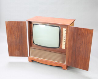 A Decca model no.CS 2632 25"/64cm colour television contained in an inlaid mahogany case 87cm x 82cm x 42cm, the back marked serial no. CS2632 88642 and 660277 