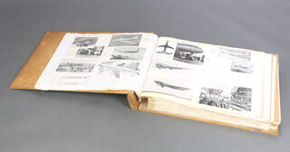 A scrap album of 1940/50's military and civil aircraft 9cm x 58cm x 41cm  