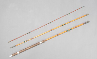 A 10' bamboo 3 piece fishing rod with green binding and a cork butt  