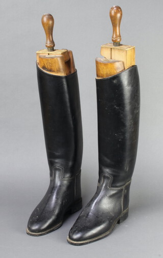 A pair of black leather riding boots size 7 together with a pair of Faulkner & Sons beech boot trees