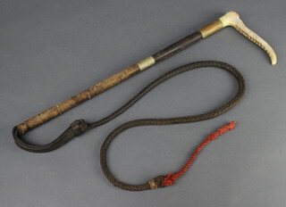 A leather hunting whip with stag horn grip, leather lash 