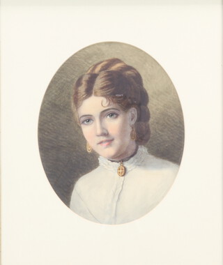 A Victorian watercolour drawing, head and shoulders portrait of a young girl 29cm oval 