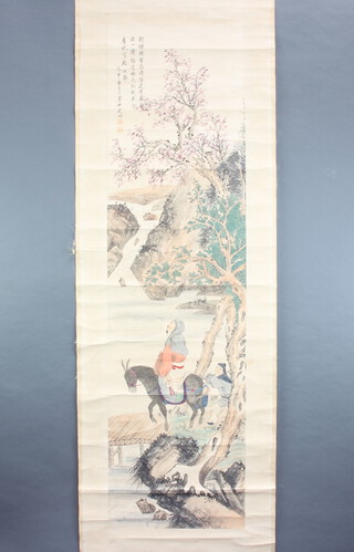 Chinese, early 20th Century hanging scroll, pen and wash depicting a gentleman on a horseback with attendant crossing a bridge beneath a flowering peony with double character mark and script, wooden ends 167cm x 45cm 
