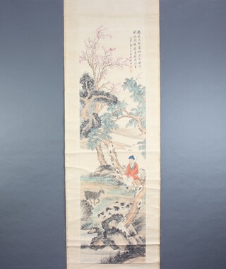 Chinese, early 20th Century hanging scroll, pen and wash depicting a seated goat herder with goat beneath trees, with double character mark and script, wooden ends 168cm x 45cm  