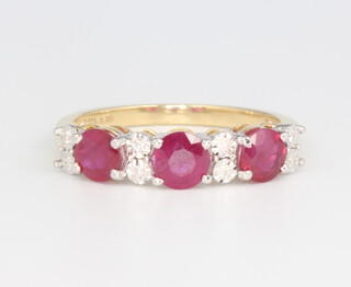A 9ct yellow gold brilliant cut ruby and diamond ring, the 3 rubies approx. 1.66ct, the illusion set 8 diamonds 0.05ct, 2.6 grams, size P 1/2