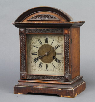 Hamburg American Clock Co., a striking mantel clock with square silvered dial, Roman numerals contained in a carved oak case 33cm x 24cm x 15cm complete with pendulum (no key)
