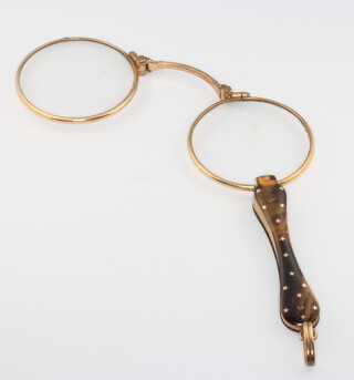 A pair of Edwardian gilt and tortoiseshell folding lorgnettes with star decoration