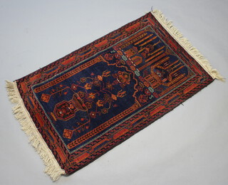 A blue and tan ground Persian prayer rug with tree of life decoration 135cm x 82cm 