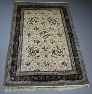 A grey and blue ground silk sculpted Chinese carpet 279cm x 183cm, the reverse with Harrods label 