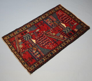 A blue and red ground Baluch rug with floral decoration 140cm x 84cm 