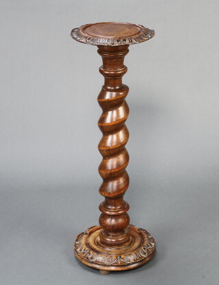 A Victorian beech and oak circular torchere raised on a spiral turned column 97cm h x 33cm w 
