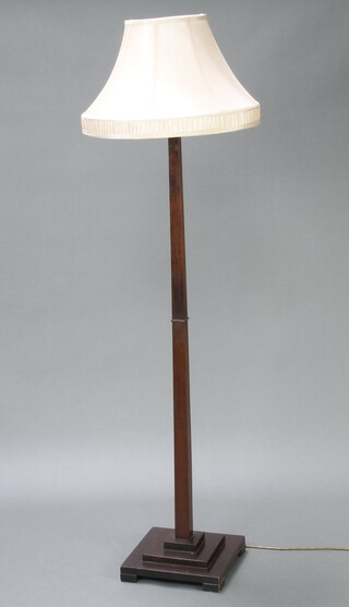 An Art Deco square mahogany standard lamp raised on a square stepped base 134cm h x 30cm 