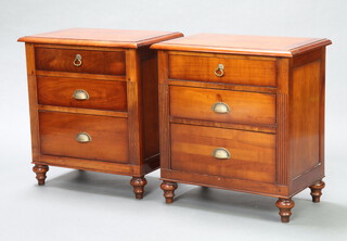 A pair of Philadelphia style mahogany bedside chests of 3 drawers with fluted columns to the side, raised on bun feet 64cm h x 60cm w x 37cm d 