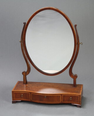 A 19th Century oval plate dressing table mirror contained in a mahogany swing frame, the crossbanded base of serpentine outline fitted 3 drawers, raised on ogee bracket feet 75cm h x 55cm w x 22cm d 