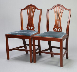A pair of Hepplewhite style mahogany camel back dining chairs with upholstered drop in seats raised on square supports with H framed stretcher 91cm h x 51cm w x 41cm d (seat 27cm x 30cm) 