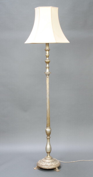 A silver painted Italian style turned and fluted standard lamp, raised on a circular base with paw feet 160cm h x 31cm 