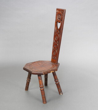A Victorian carved oak spinning chair with solid back and heart decoration, raised on turned supports, back marked Mother From AMJ December 1889 88cm h x 31cm w x 39cm d  