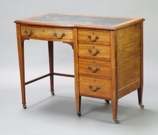 An Edwardian inlaid mahogany desk with green inset writing surface, fitted 5  drawers with gilt swan neck drop handles, raised on brass casters 72cm h x 90cm w x 51cm d  