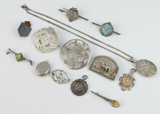 A silver sports fob, 2 lockets and minor brooches etc 