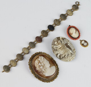 A Victorian gilt carved lava portrait bracelet together with 3 cameos and a pendant 